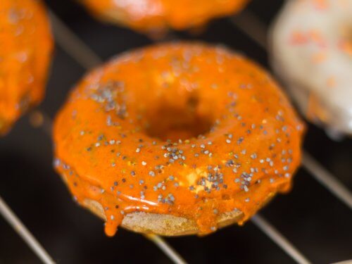 Baked Halloween Pumpkin Donuts - glazing the donuts